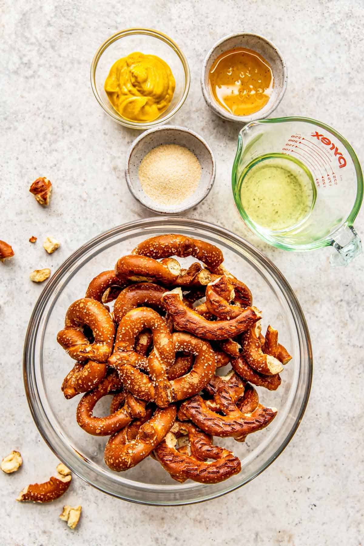 The ingredients for honey mustard pretzels are placed on a counter. 