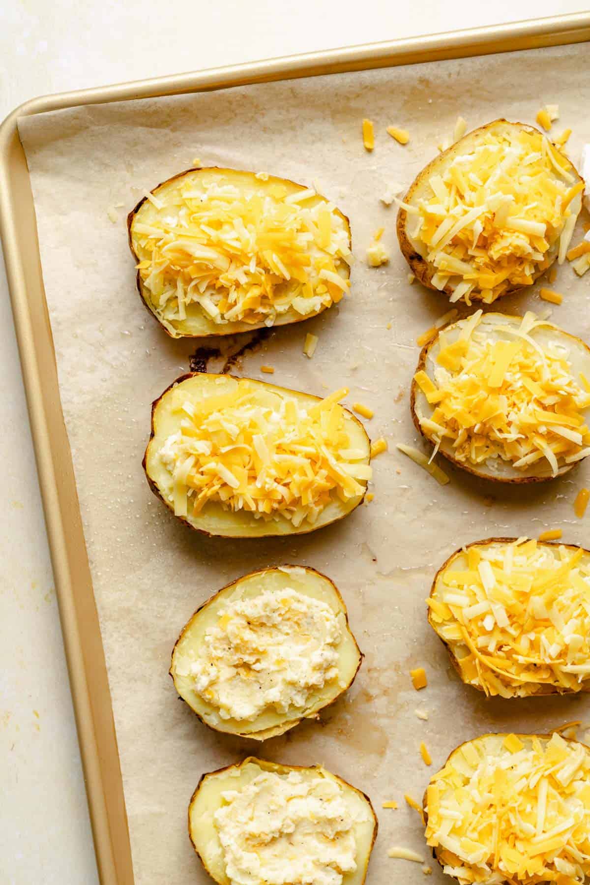 cheese is placed on top of potatoes