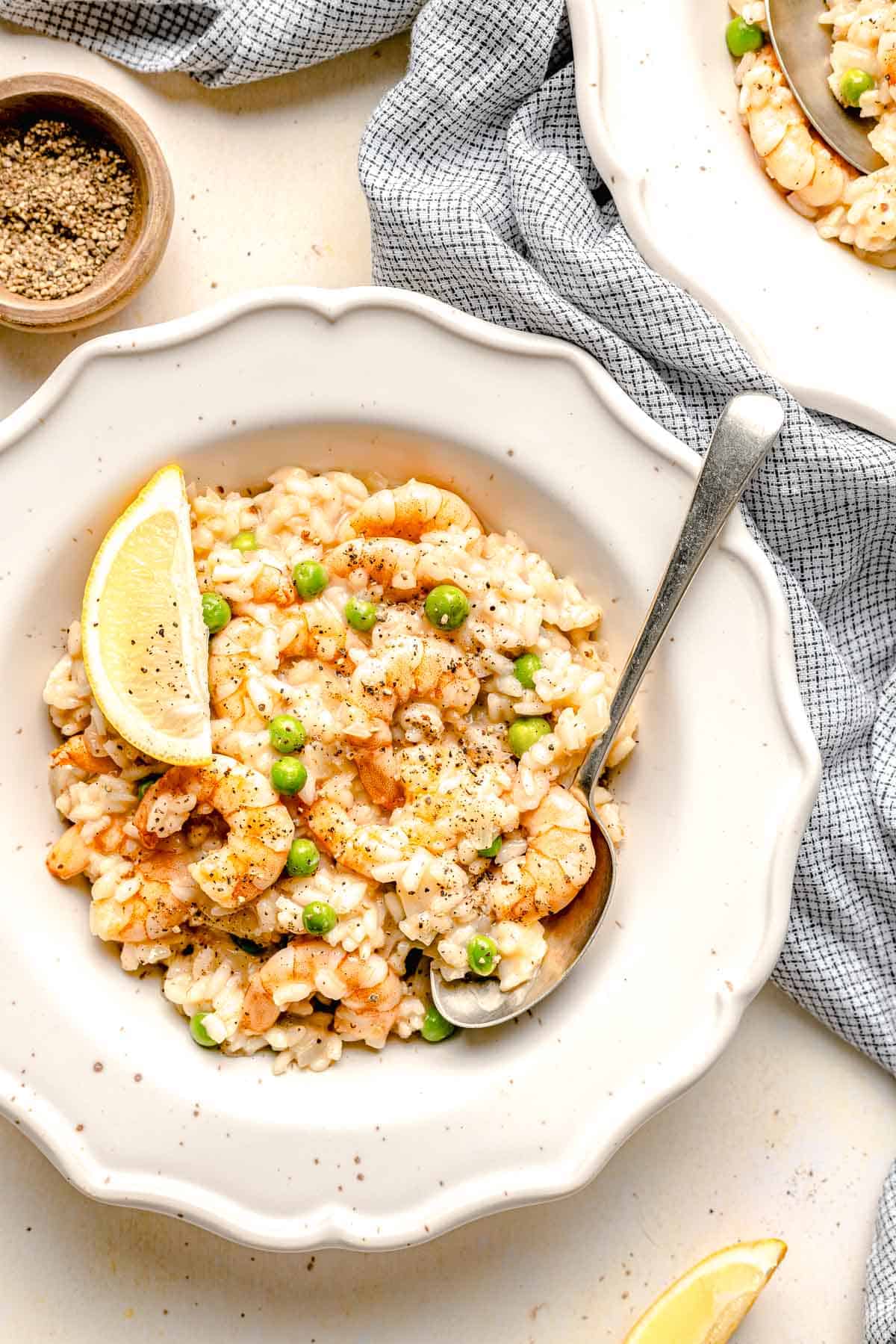 Overhead image of shrimp risotto in a bowl with a spoon.