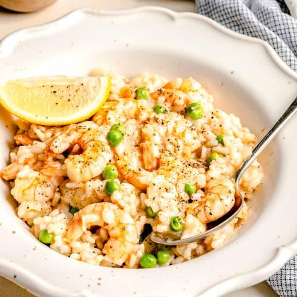 Shrimp risotto in a bowl with a spoon.