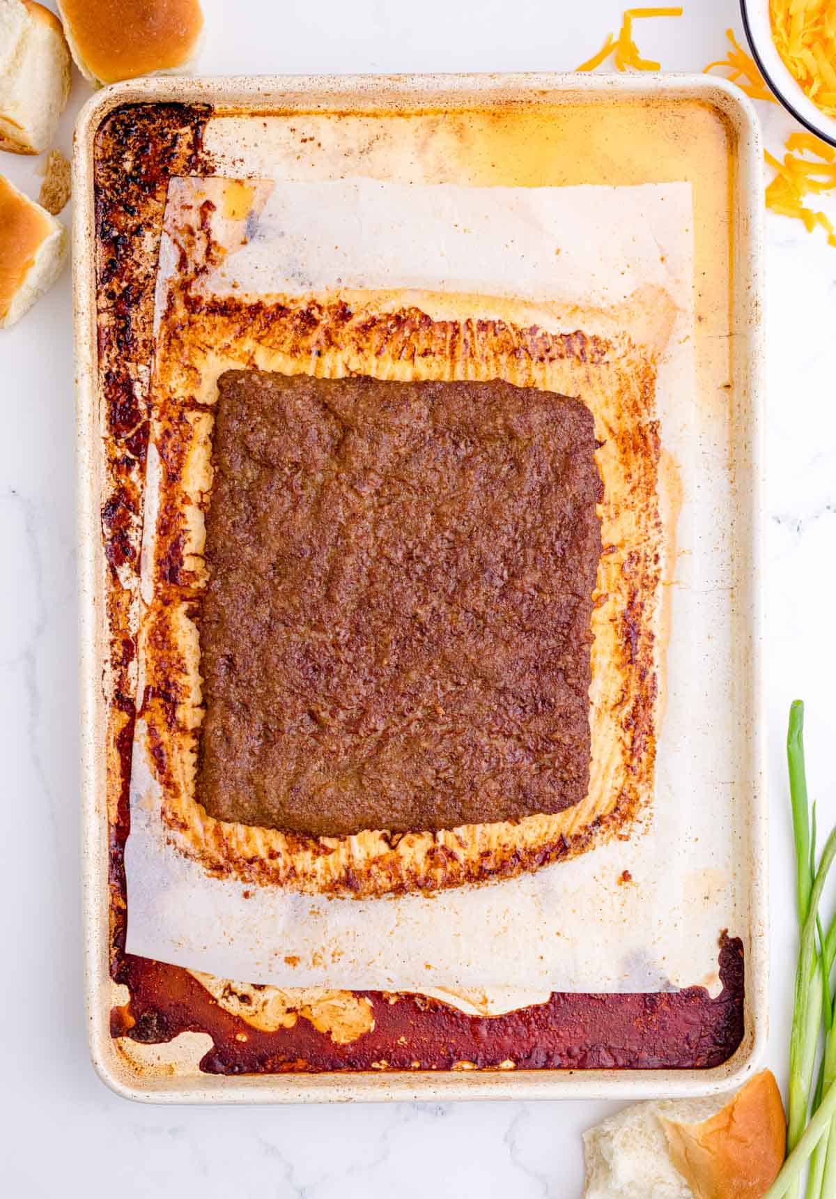 baked pork sausage on a metal baking sheet