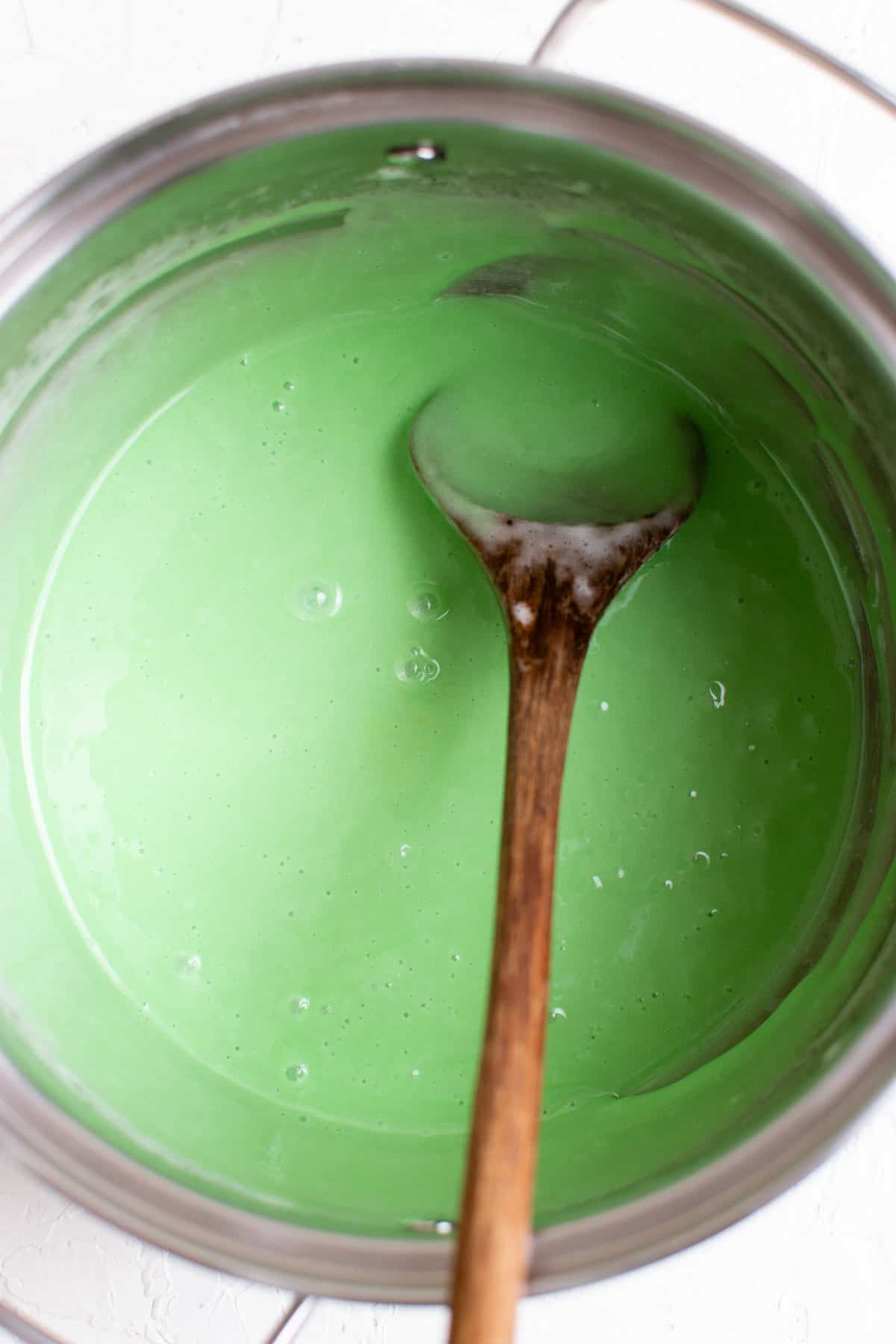 the marshmallow mixture in a pot has been dyed green