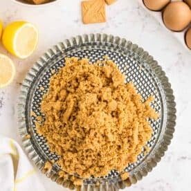 shortbread crumbs on a metal tart pan