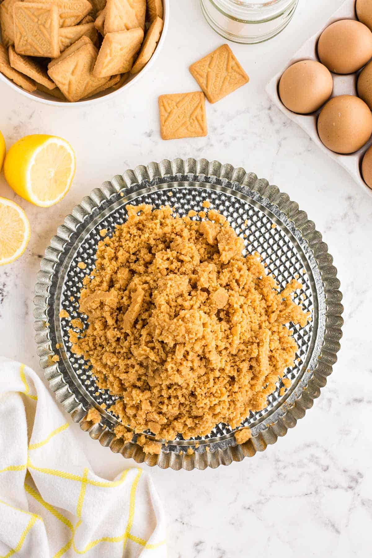 shortbread crumbs on a metal tart pan