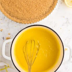 whisking lemon curd mixture together