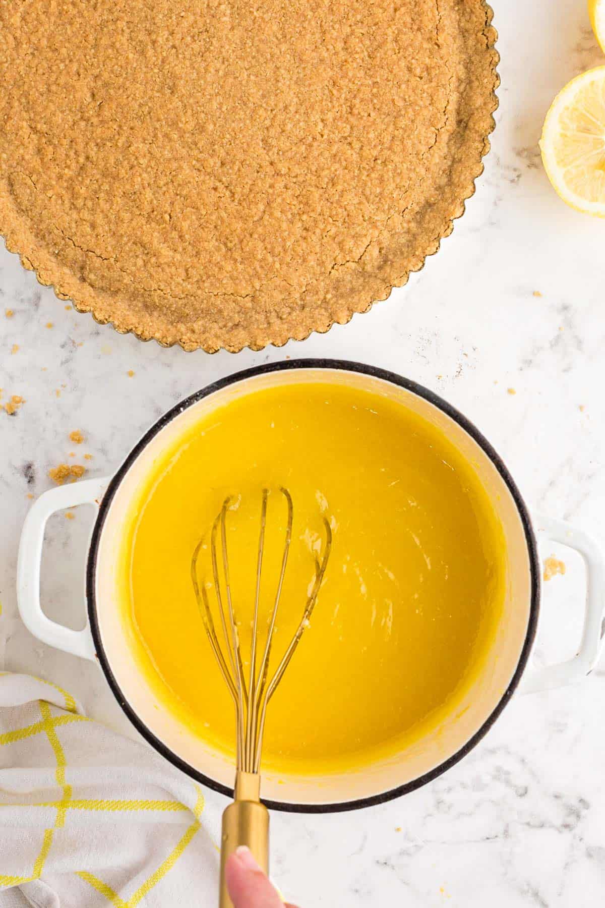 whisking lemon curd mixture together