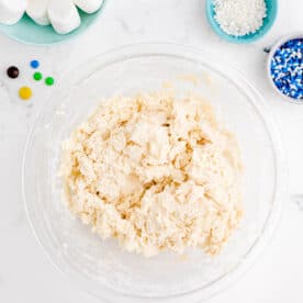 cookie dough in a clear bowl for melted snowman cookies