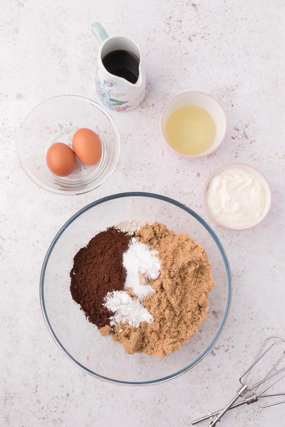 dry ingredients for mini bundt cakes in a glass bowl