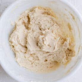 raspberry thumbprint cookie dough formed in a white bowl