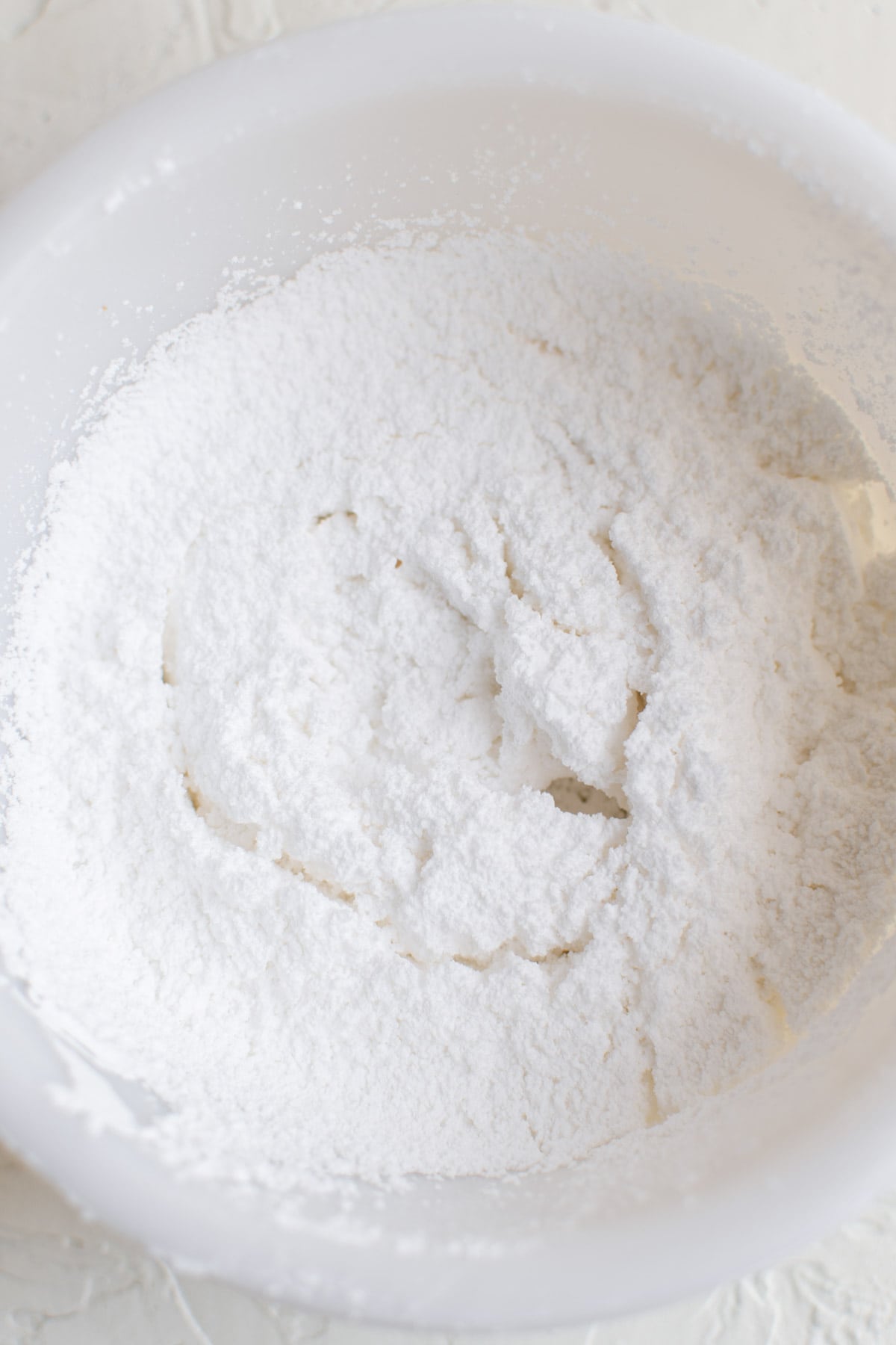 sifted powdered sugar in a white bowl