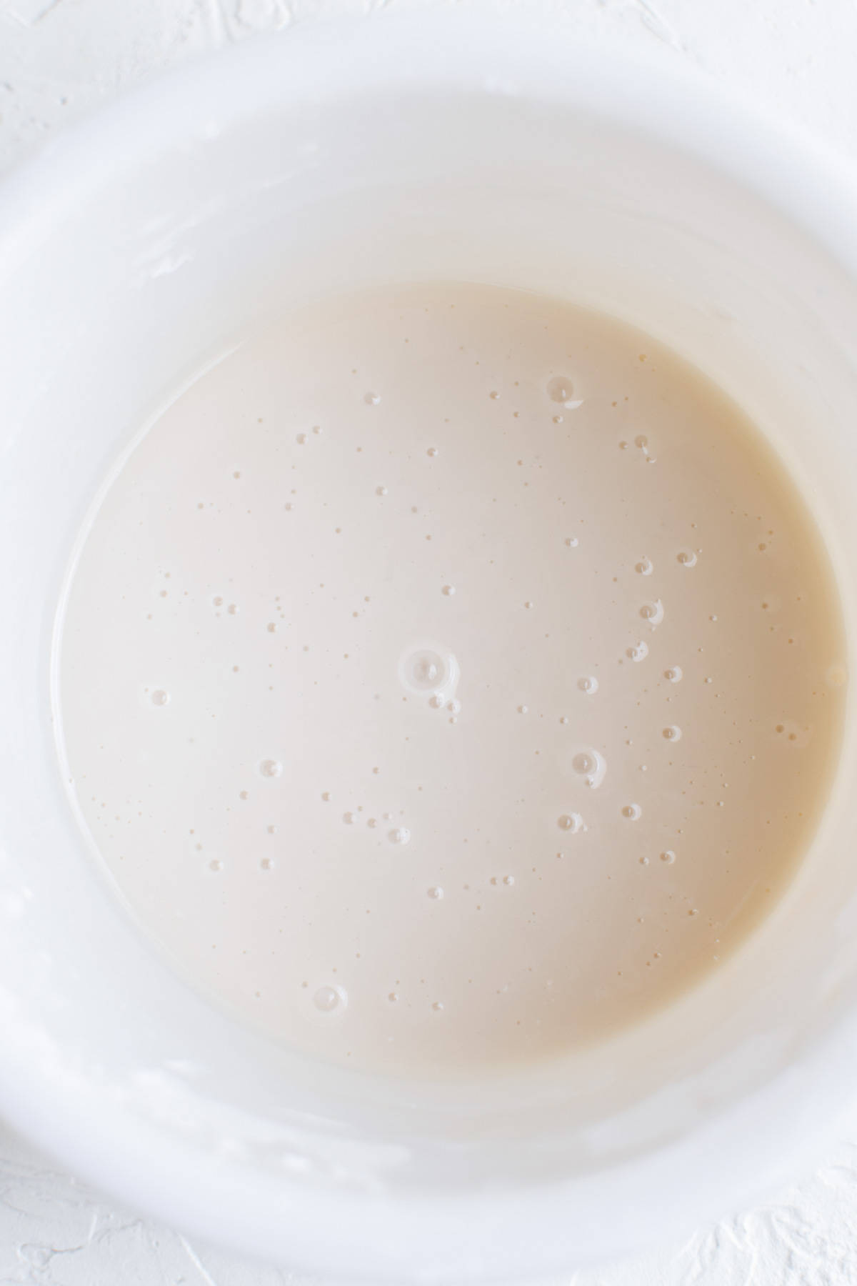 white icing in a white bowl