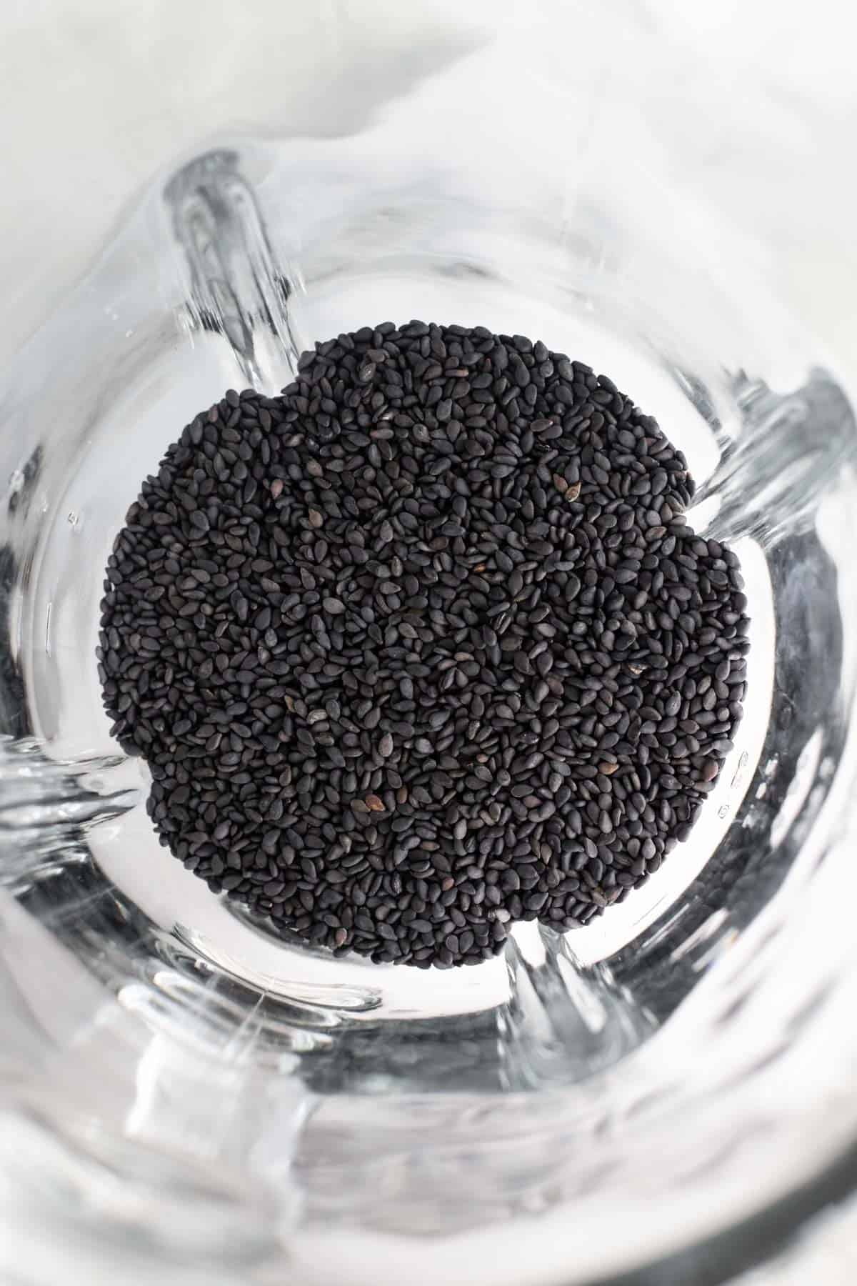 black sesame seeds in a glass blender jar