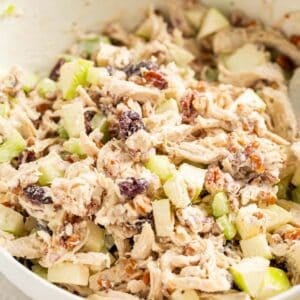 cranberry pecan chicken salad in a large white bowl