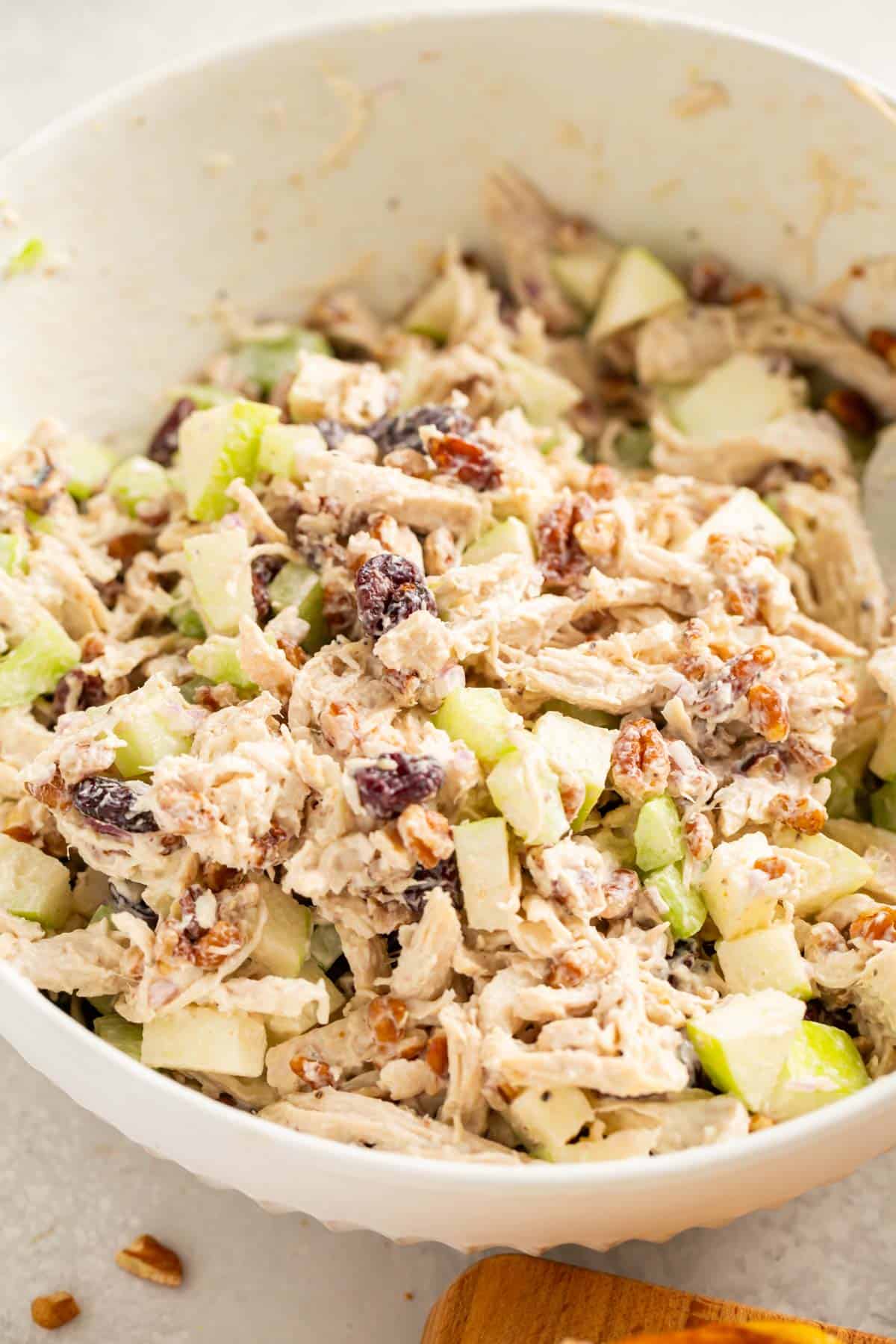 cranberry pecan chicken salad in a large white bowl
