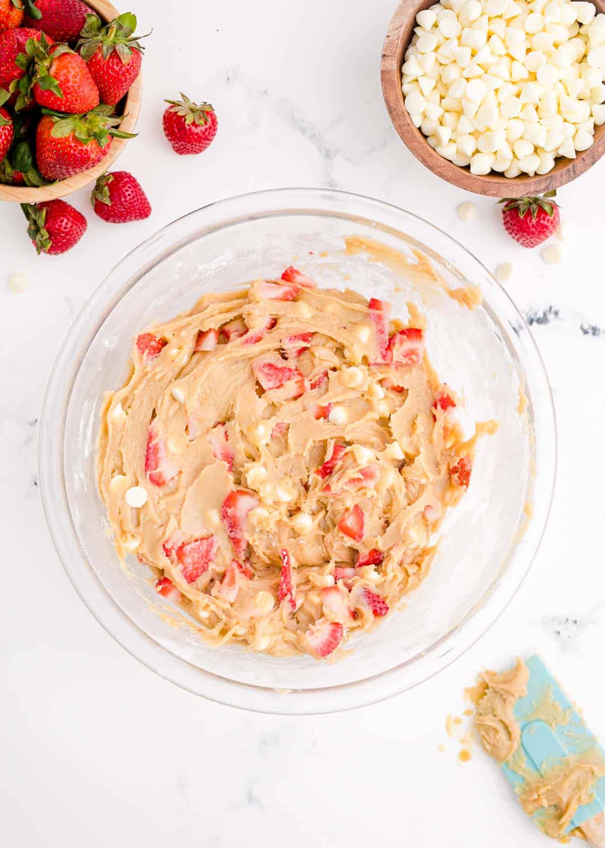 chopped fresh strawberries mixed into blondie mixture with white chocolate chips