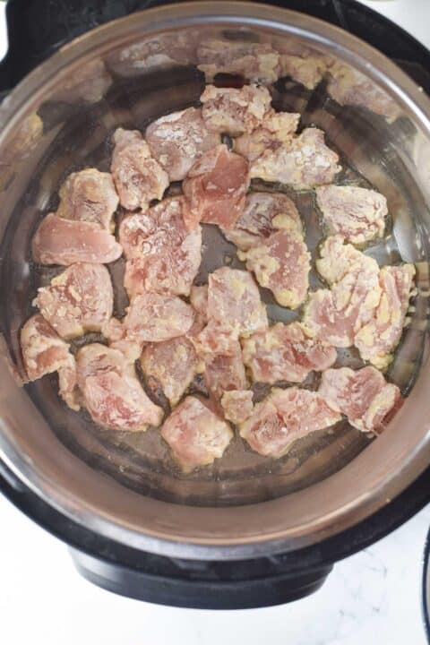 battered chicken pieces shallow frying in an instant pot
