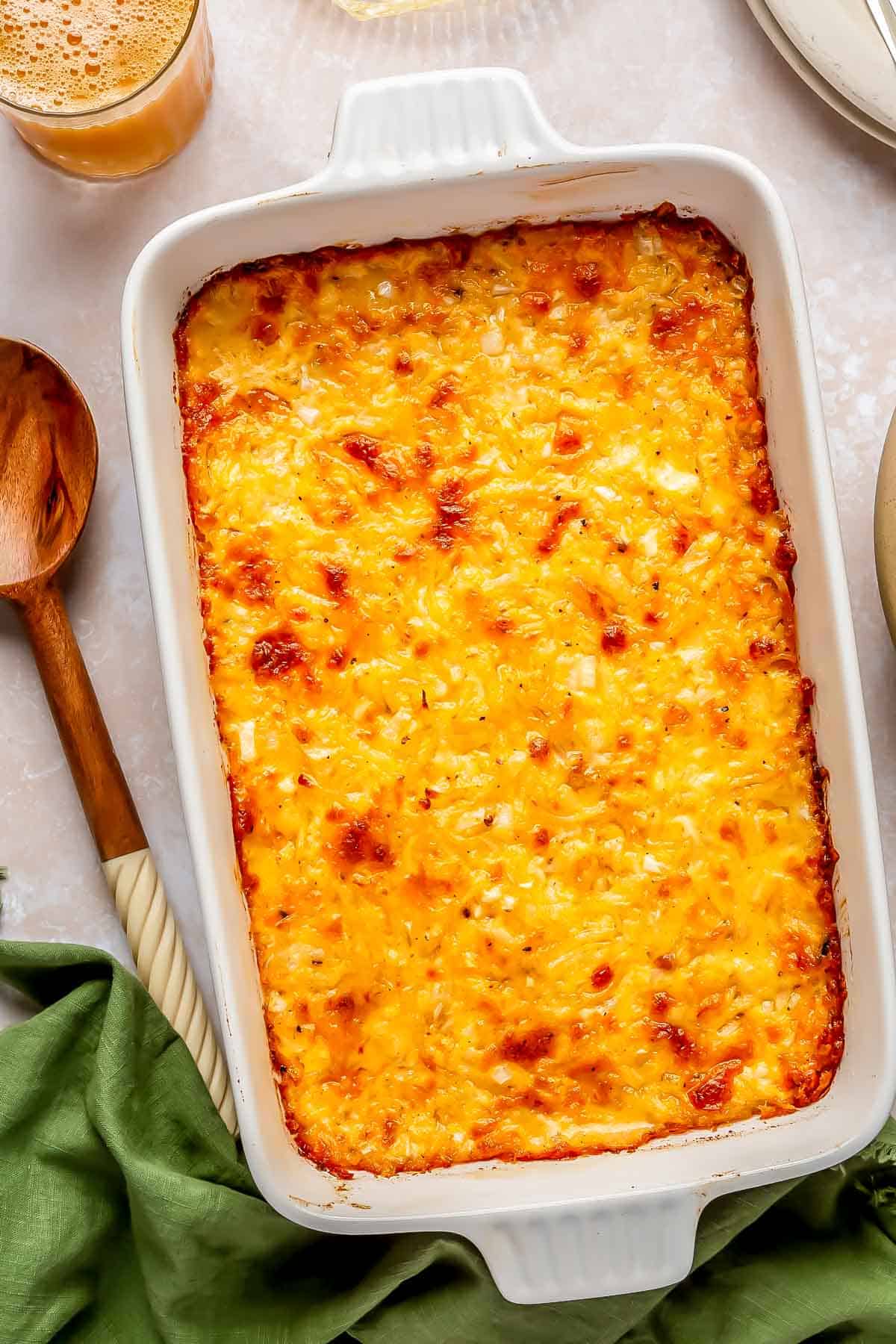 cheesy hashbrown casserole baked with browned cheese on top