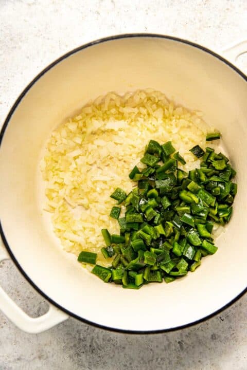 chopped poblano peppers added to the onion and garlic mixture