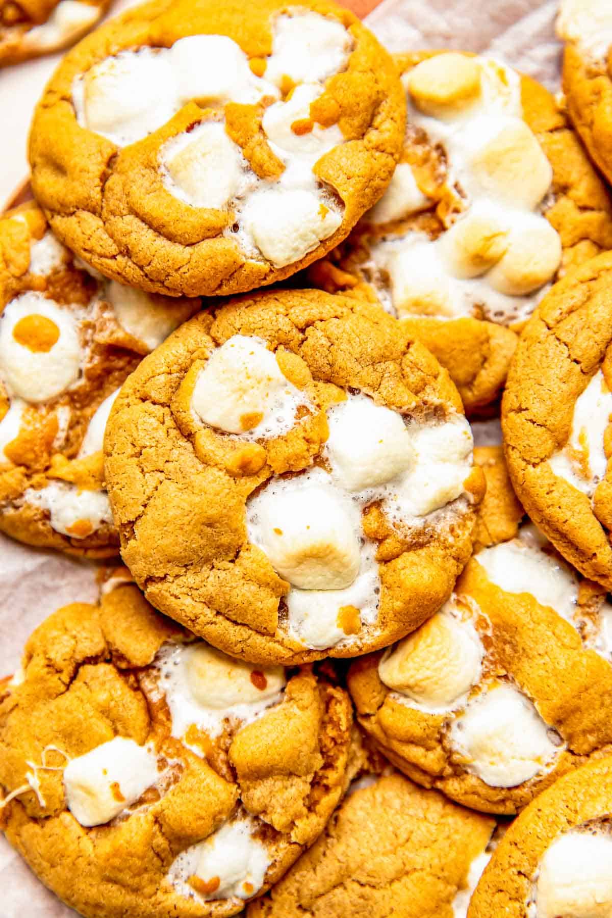 a pile of fluffernutter cookies with slightly toasted marshmallows
