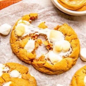 a fluffernutter cookie is pulled apart to show gooey marshmallow