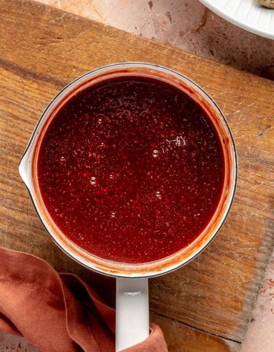 grape jelly and chili sauce mixed together in a small saucepot