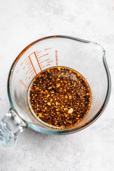 sauce ingredients for green bean beef stir fry in a clear measuring cup