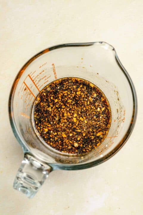ingredients for the sauce mixture for green bean chicken stir fry in a glass measuring cup