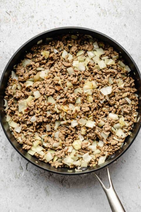 ground beef and onions in a nonstick skillet