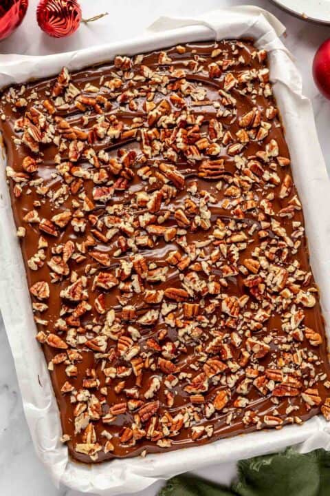 chopped pecans sprinkled on top of chocolate