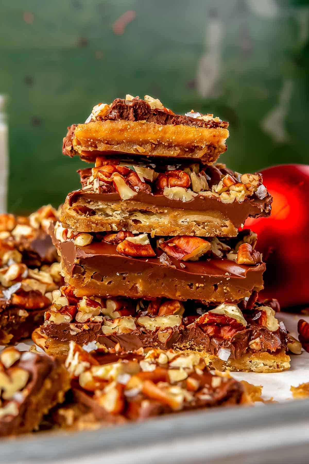 saltine toffee stacked on top of one another on a baking sheet
