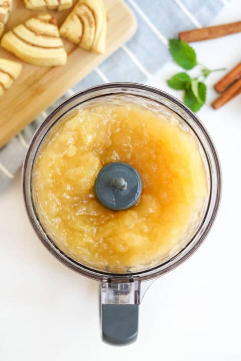 apple pie filling is pureed in a food processor bowl