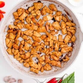 cubed chicken is cooked in a nonstick skillet