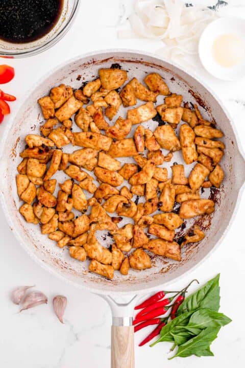 cubed chicken is cooked in a nonstick skillet