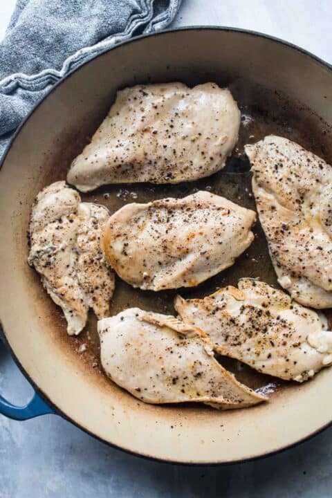 chicken breasts cooked and browned in a dutch oven