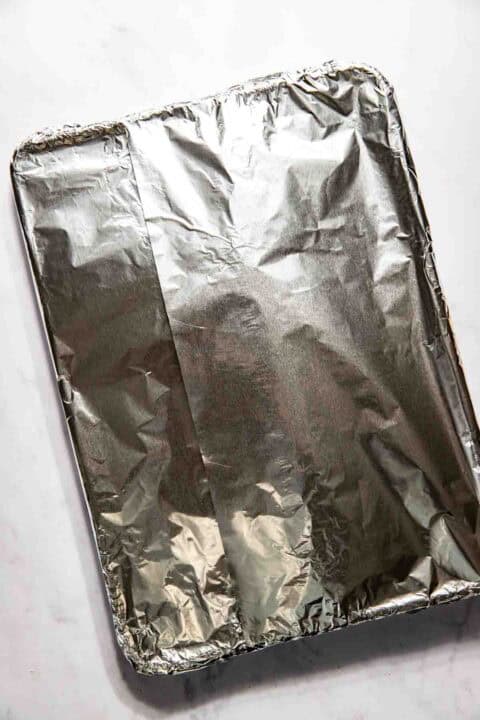 A baking tray covered with aluminum foil.